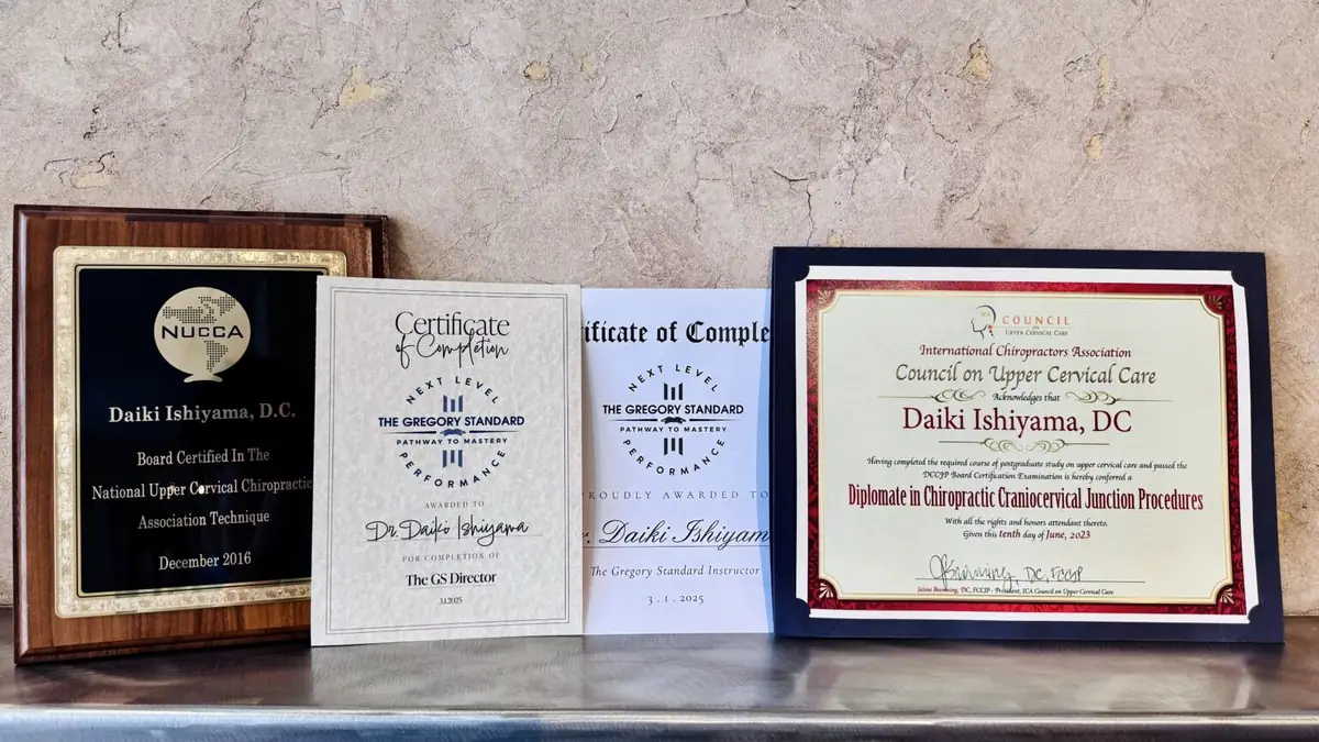 Board certification plaque and diplomas awarded to Dr. Daiki Ishiyama