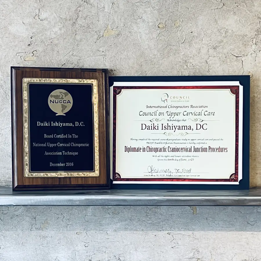 NUCCA board certification plaque and DCCJP diploma